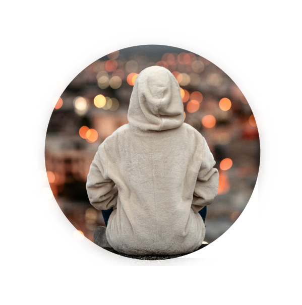 Sexual offence solicitor's page - rear view of a person sat wearing a hoodie